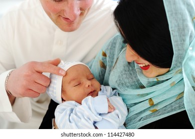 Arabic Mother and Father with baby at home