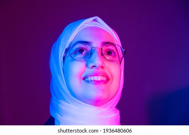 Arabic Muslim Girl With Multicolored Light On Her Face