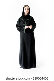 Arabic Muslim girl wearing black robe over white background posing