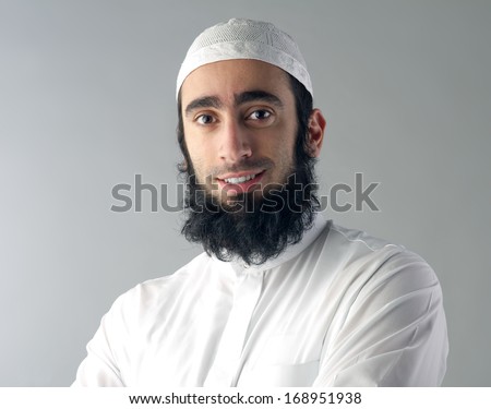 Arabic Muslim man with beard smiling 