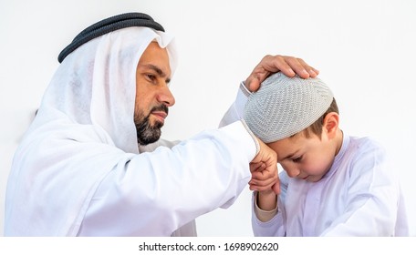 Arabic muslim son kissing his father hand