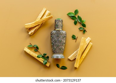 Arabic Oud Oil Perfume In Silver Bottle With Crystals And Sticks Of Tree