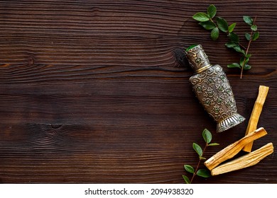 Arabic Oud Oil Perfume In Silver Bottle With Crystals And Sticks Of Tree