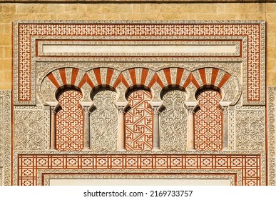 Arabic patterns on the gate Puerta de San Ildefonso in moorish style, walls of the ancient Mezquita, Mosque-Cathedral of Cordoba, Spain. - Shutterstock ID 2169733757
