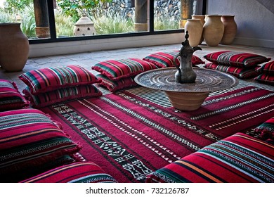 Arabic Setting For A Majlis With Traditional Cushions And An Arabic Coffee Pot In The Middle. Muscat, Oman.