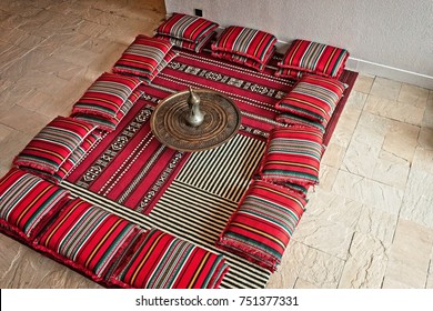 Arabic Setting For A Majlis With Traditional Cushions And An Arabic Coffee Pot In The Middle. Muscat, Oman