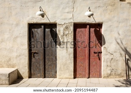 Arabic style carved wooden doors in Al Fahidi Historical District, Deira, Dubai, United Arab Emirates. 