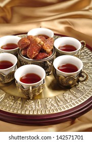 An Arabic Tea Set With Dates