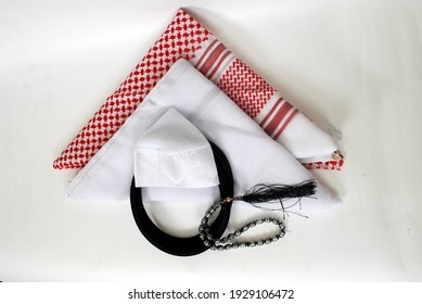 Arabic traditional clothing accessories Agal, Islamic cap and rosary,Shemagh with white Ghutrah isolated on white background - Powered by Shutterstock
