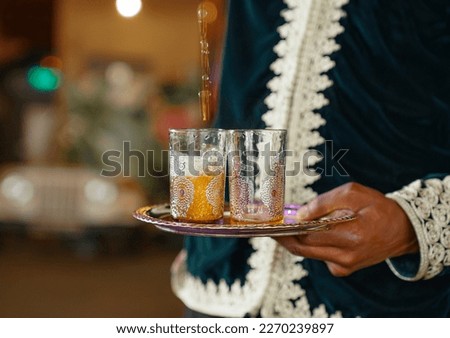 Arabic Traditional Hospitality (Saudi Arabia). Bedouin lifestyle People.
dallah is a metal pot with a long spout designed specifically for making Arabic coffee, Saudi coffee 