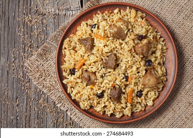 Arabic traditional national delicious rice food called pilaf cooked with fried meat, onion, carrot and garlic