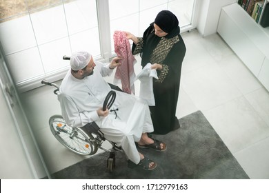 Arabic wheelchaired man at home