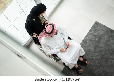 Arabic wheelchaired man at home