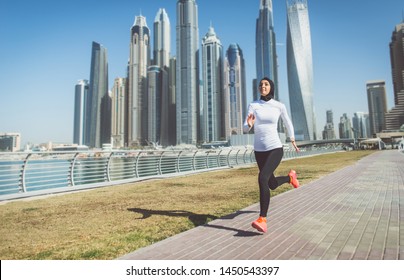 Arabic woman runner, making some urban running
