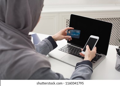 Arabic Woman Shopping Online On Laptop With Credit Card, Back View, Empty Screens