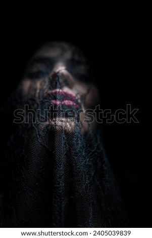Arabic woman wearing a black veil, cover her face