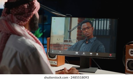 Arabic worker in video call session with therapist, asking for advice, feeling down. Remotely working Middle Eastern employee in online consultation with psychologist from stylish cozy home