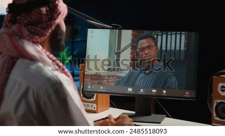 Arabic worker in video call session with therapist, asking for advice, feeling down. Remotely working Middle Eastern employee in online consultation with psychologist from stylish cozy home