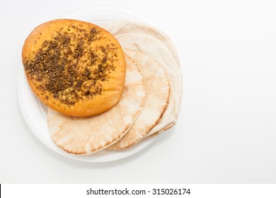 Arabic Zaatar Bread And Kuboos Bread  In A Plate On White Background