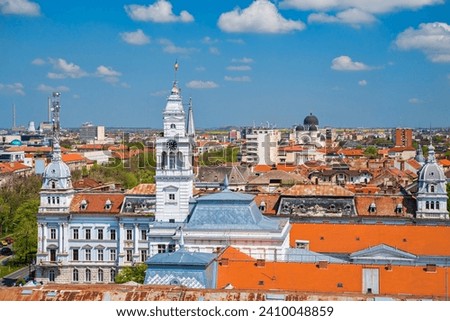 Arad City Hall and aerial view of the city during summer. Arad City Hall in Romania is situated in the city center, and it serves as the administrative headquarters for local government activities.
