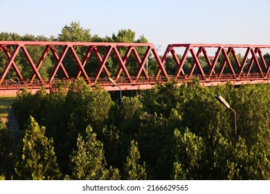 ARAD, ROMANIA, 03 MAY 2022: Red bridge over Mures river in Arad, Romania, Europe	
