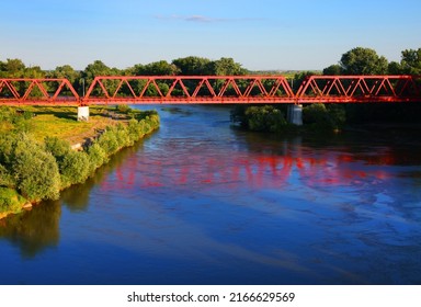 ARAD, ROMANIA, 03 MAY 2022: Red bridge over Mures river in Arad, Romania, Europe	
