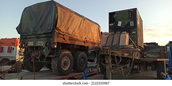 Arad,  Romania - February 12 2022: US Army Vehicle Convoy The Way To Military Maneuvers In Romania