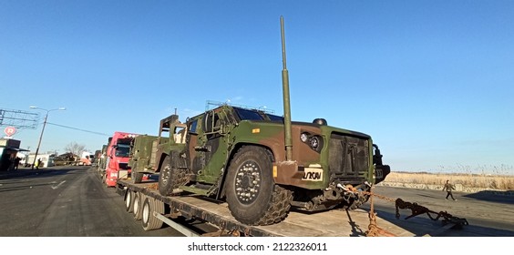 Arad,  Romania - February 12 2022: US Army Vehicle Convoy The Way To Military Maneuvers In Romania