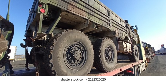 Arad,  Romania - February 12 2022: US Army Vehicle Convoy The Way To Military Maneuvers In Romania