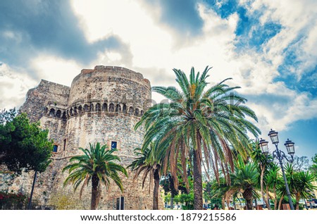 Aragonese Castle Castello Aragonese stone medieval buildings and palm trees in Piazza castello square in Reggio Calabria historical city centre, Southern Italy