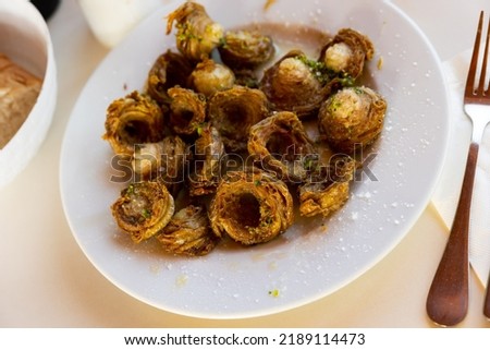 Aragonese Cuisine - fried lamb small iIntestine rings with garlic. Madejas aragones
