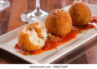 Arancini or Risotto Croquettes food plating with wine. - Shutterstock ID 1985671649