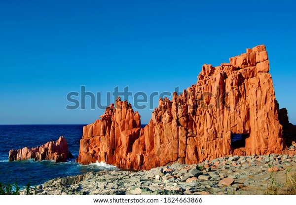 Arbatax with the known red porphyry rocks nearby the\
port at the Capo Bellavista, Sardinia, Italy, Europe, fragment of\
Red rocks of Arbatax, Sardinia, Arbatax with known red rocks, Red\
Rock fragment, 