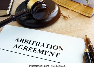 Arbitration Agreement Resolution Of Commercial Disputes On A Desk.