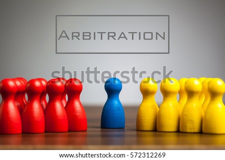 Arbitration concept with pawn figurines on table, grey background