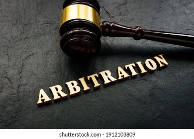 Arbitration Word From Wooden Letters And Gavel In Court.