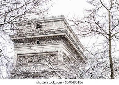 Arc De Triomphe During A Winter Snow Fall In Paris, France