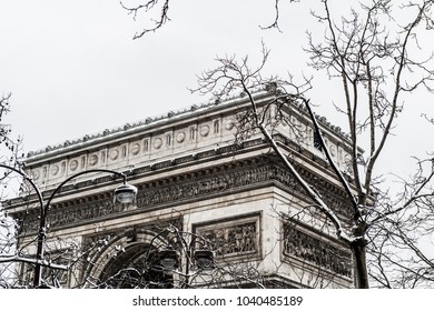 Arc De Triomphe During A Winter Snow Fall In Paris, France