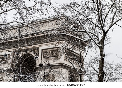 Arc De Triomphe During A Winter Snow Fall In Paris, France