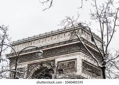 Arc De Triomphe During A Winter Snow Fall In Paris, France