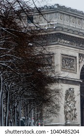 Arc De Triomphe During A Winter Snow Fall In Paris, France