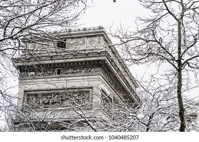 Arc De Triomphe During A Winter Snow Fall In Paris, France