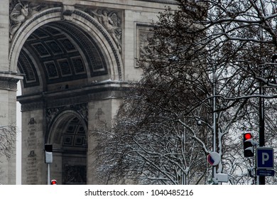 Arc De Triomphe During A Winter Snow Fall In Paris, France