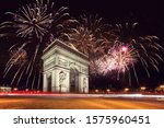 Arc De Triomphe (Paris, France) with fireworks during New Year celebration