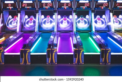 Arcade Game With Pink, Blue, Purple and Yellow Neon Lighting  - Powered by Shutterstock