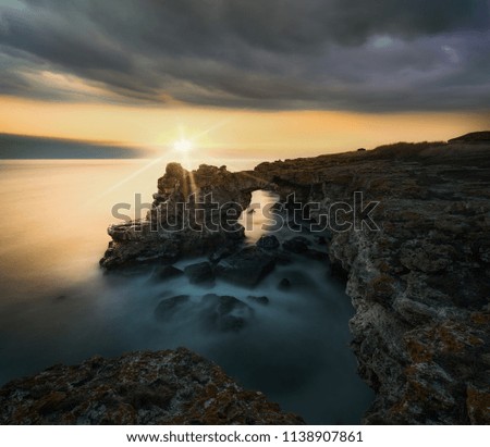 Similar – Image, Stock Photo Rocky cliff with sunset on the horizon