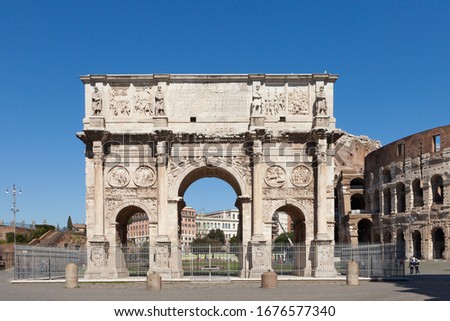 The Arch of Constantine (Arco di Costantino). 
Triumphal arch and Colosseum on background. Rome, Italy 