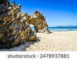 The Arch is a distinctive rock formation located at the west end of Mile Beach at the north end of The Neck that separates the north and south half of Bruny Island, Tasmania, Australia.