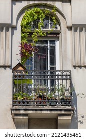 Arch Door Balcony Terrace With Ironwork Fence and Birdhouse