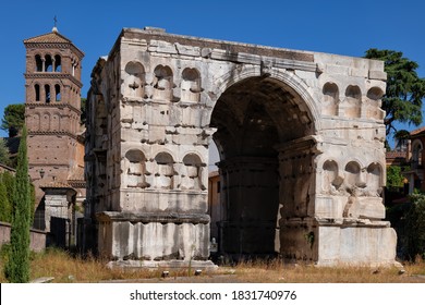 The Arch of Janus, ancient Roman quadrifrons triumphal arch in Rome, Italy, landmark from 4th century CE and tower of Basilica of San Giorgio in Velabro